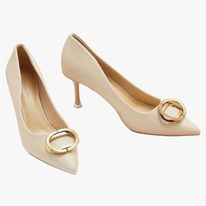 C. Paravano White Pumps with Gold Accent